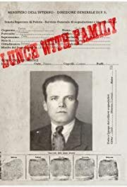 Old-looking paper with a male headshot and the words "lunch with family" stamped over the top